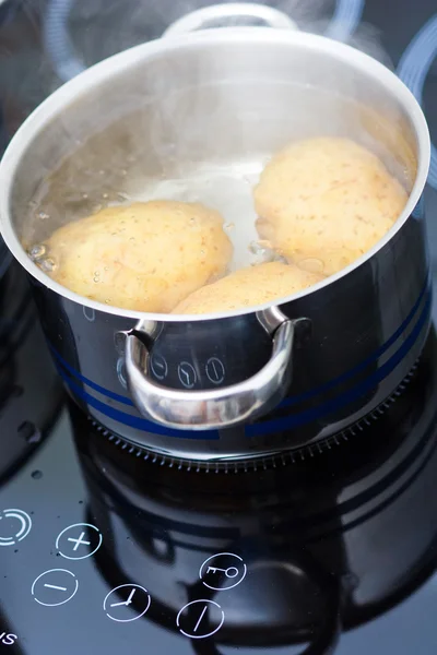 stock image Potato boiling in water