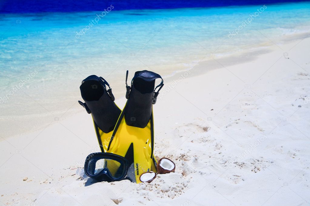 Diving Mask with fins on beach