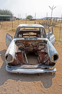 Old car in Namibian desert clipart