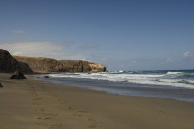 Footprints on the beach Lapared on Canar clipart