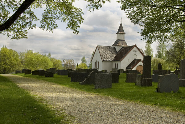 Old cemetery with white Church