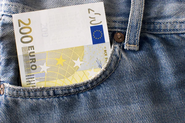 Two hundred Euro banknote in jeans pocket. — Stock Photo, Image