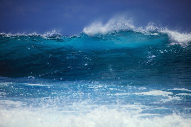 Storm surf surges against Oahu shore clipart