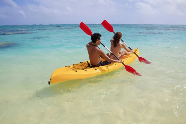 Young couple kayaking in hawaii Stock Photo