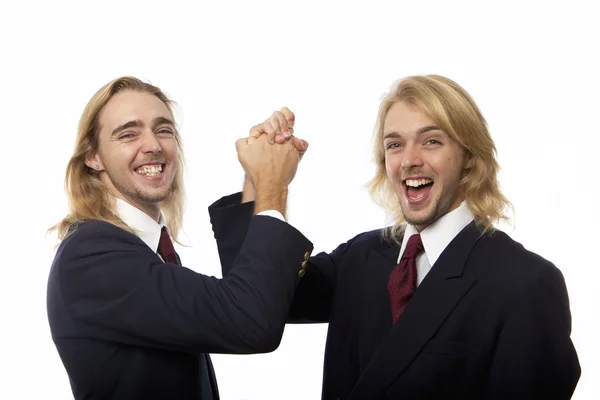 Twin brothers clasping hands — Stock Photo, Image