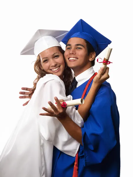 Hochschulabsolventen in Mütze und Kleid — Stockfoto
