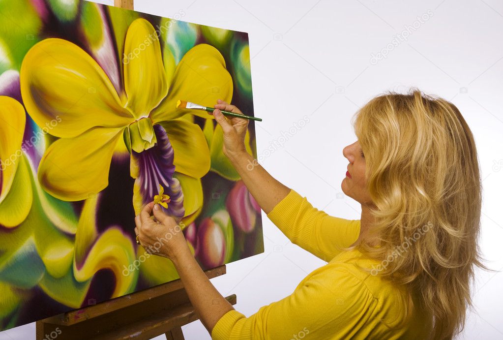 Female artist painting dendrobium orchids