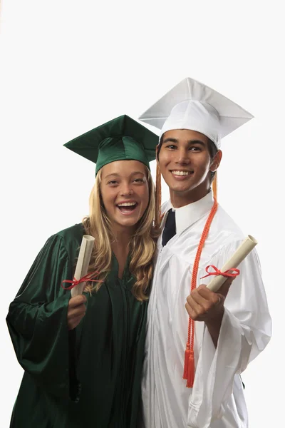 两个毕业生的帽子和衣服 — 图库照片