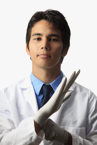 Echnician putting on his gloves — Stock Photo, Image