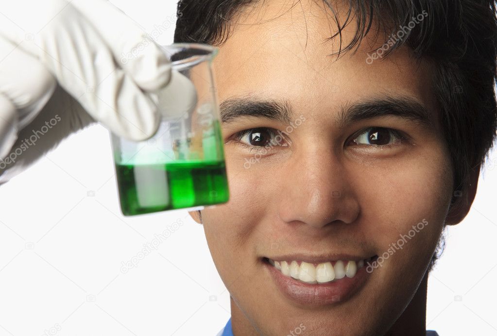 Lab technician holding a beaker