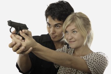Man and woman with handgun clipart