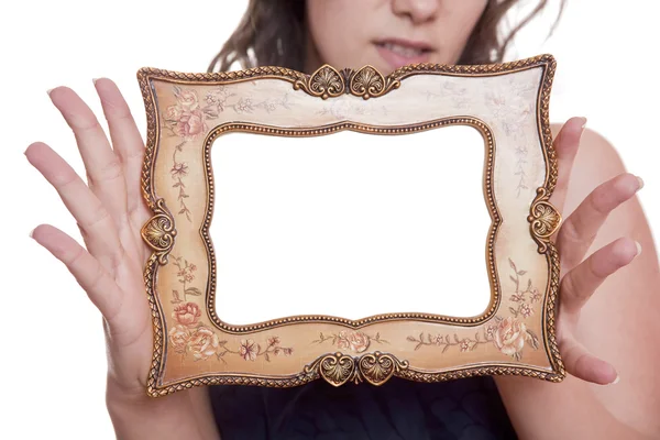 Woman holding an empty picture frame — Stock Photo, Image