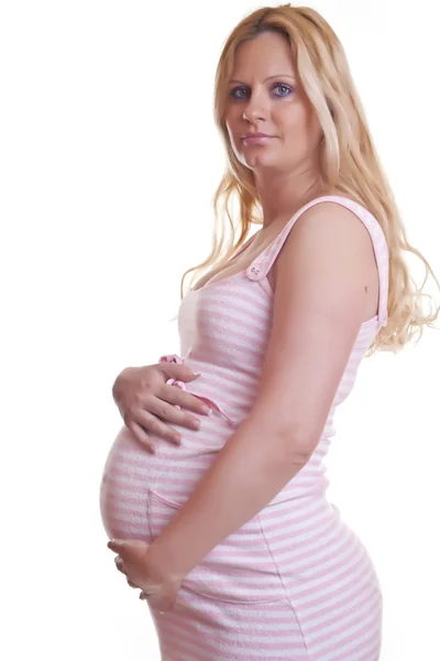 Hamile kadın tutarak karın — Stok fotoğraf