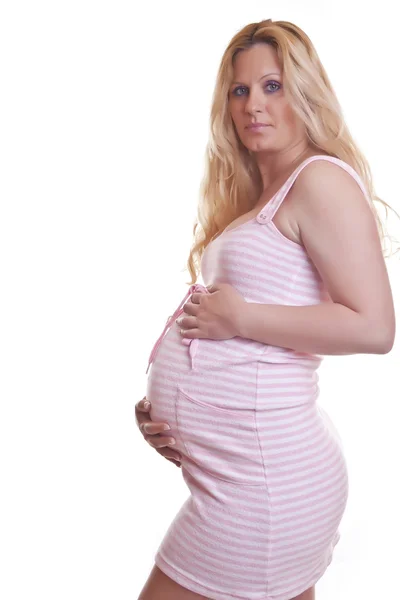 Hamile kadın tutarak karın — Stok fotoğraf