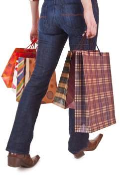 Happy woman holding shopping bags clipart