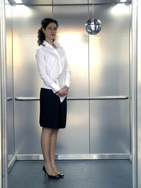 Office worker in lift — Stock Photo, Image