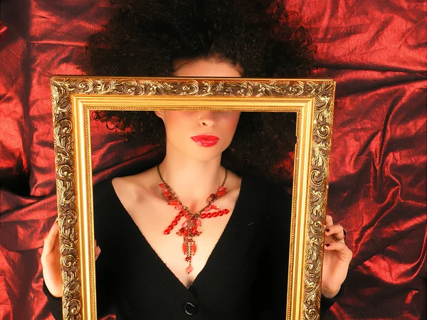 Lady with frame on red — Stock Photo, Image