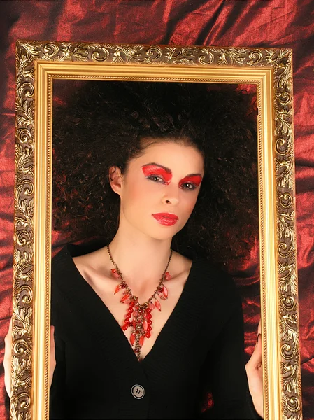 Lady with frame on red — Stock Photo, Image