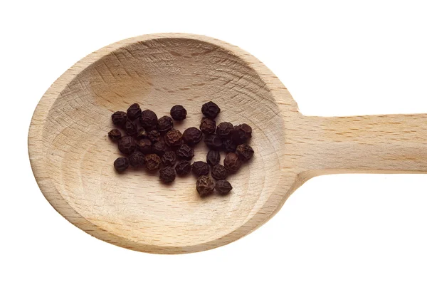 Kruiden en specerijen op houten lepels - peper — Stockfoto