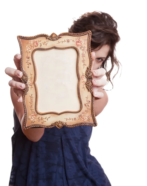 Woman hiding face with an picture frame — Stock Photo, Image