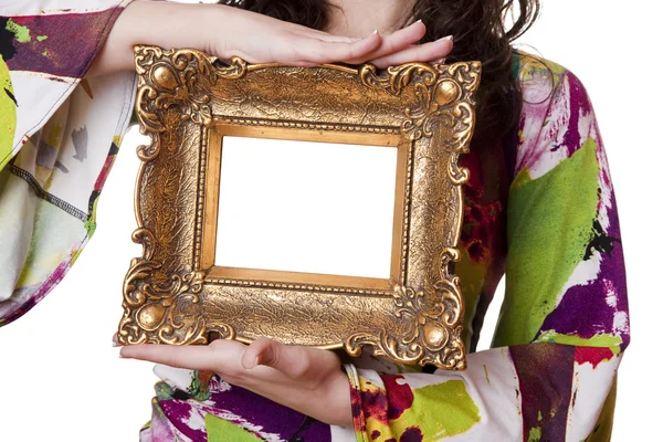 Mujer sosteniendo un marco de imagen —  Fotos de Stock