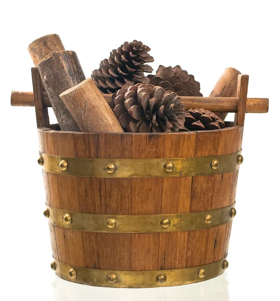 Basket with pine and wood — Zdjęcie stockowe