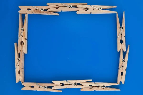 Frame made of wooden clothes pegs — Stock Photo, Image