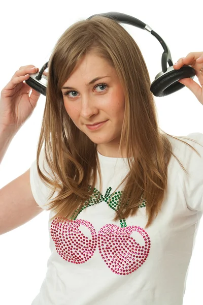 A jovem menina bonita com fones de ouvido — Fotografia de Stock
