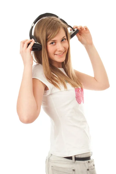 En年轻的女孩用耳机 Stockfoto