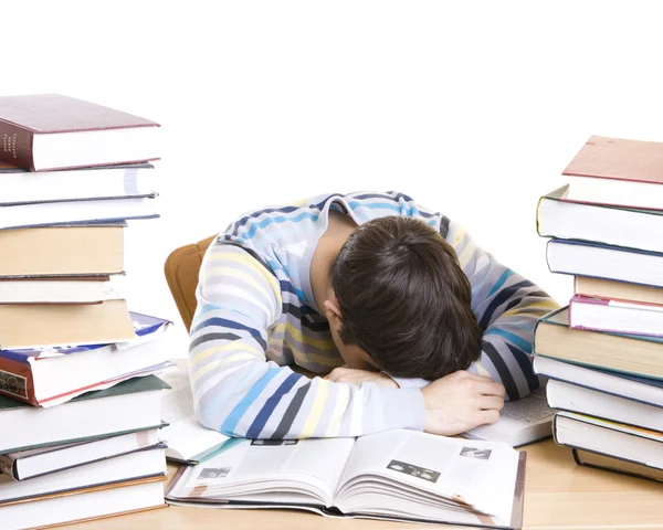 Lo studente addormentato con libri Immagini Stock Royalty Free