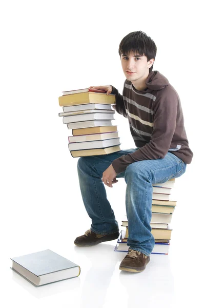 El joven estudiante con los libros Imagen de archivo