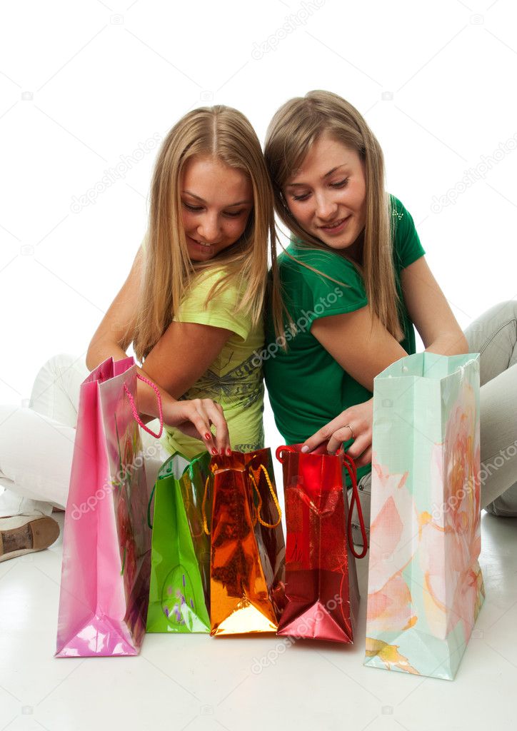Two beautiful girls with packages