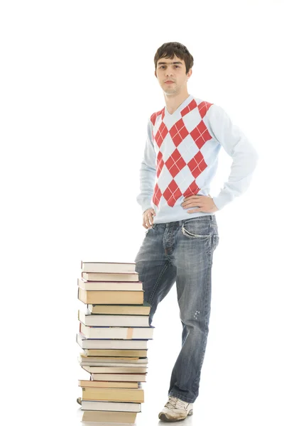 De jonge student met de boeken — Stockfoto