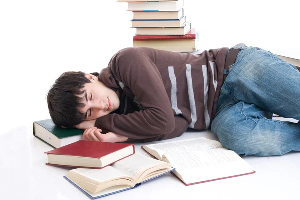 Kitaplar ile uyuyan öğrenci — Stok fotoğraf