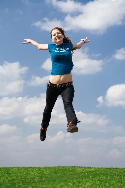 stock image The happy jumping girl