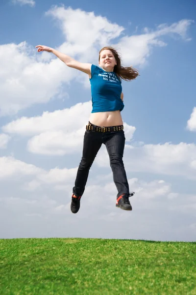 stock image The happy jumping girl