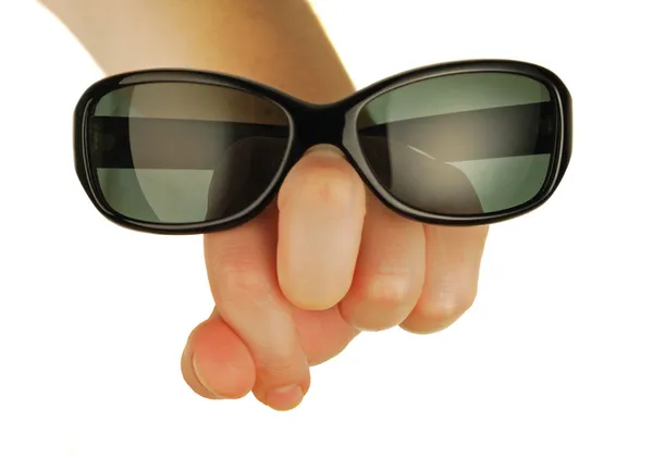 Glasögon på en kvinnlig hand — Stockfoto