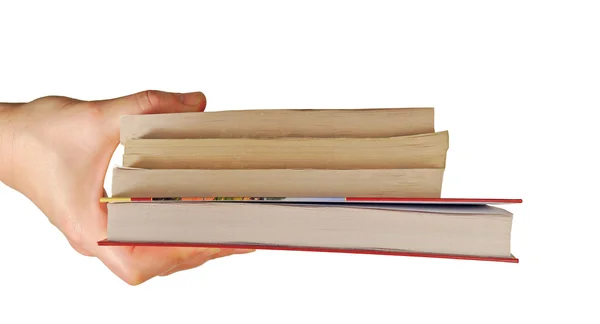 Mão detém livros diferentes — Fotografia de Stock