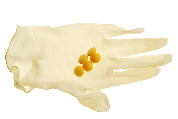 Handschuh und einige Tabletten — Stockfoto