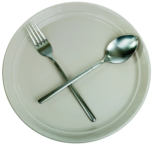Пустая тарелка, вилка и ложка — стоковое фото