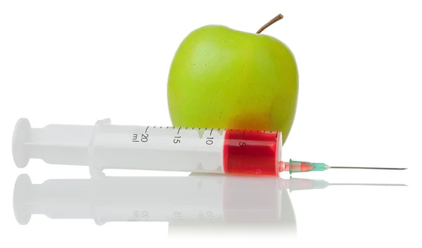 Green apple and a syringe — Stock Photo, Image