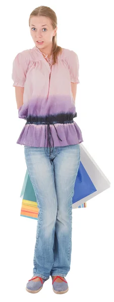 Молодая девушка с покупками — стоковое фото