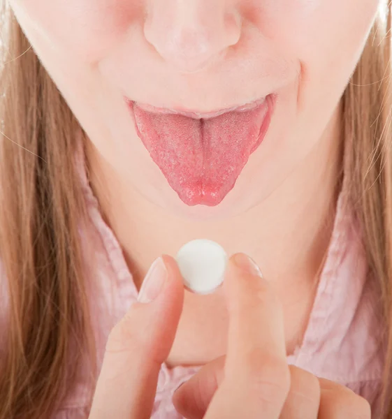 Zunge und Tablette — Stockfoto