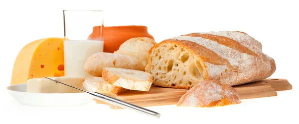 Pedaço de manteiga, pão e uma faca — Fotografia de Stock