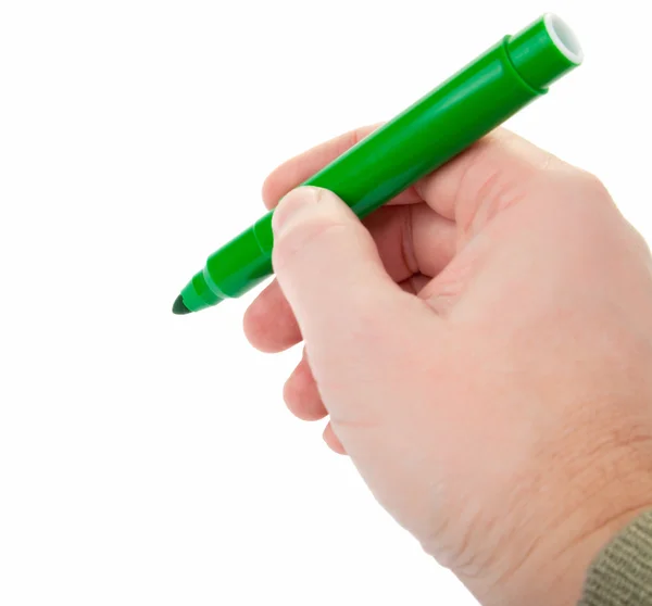 Man's hand holding a green felt-tip — Stock Photo, Image