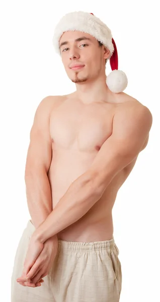 Uomo con busto nudo e cappello da Babbo Natale — Foto Stock