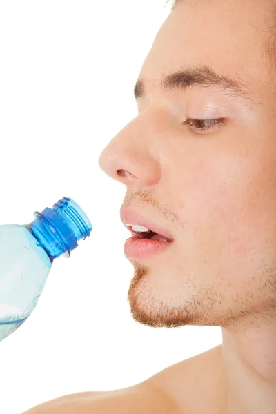 Sportsman with a bottle of clear liquid — Stock Photo, Image