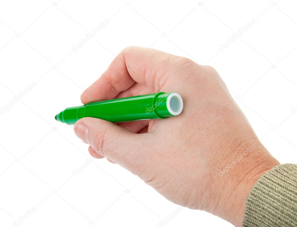 Man's hand holding a green felt-tip