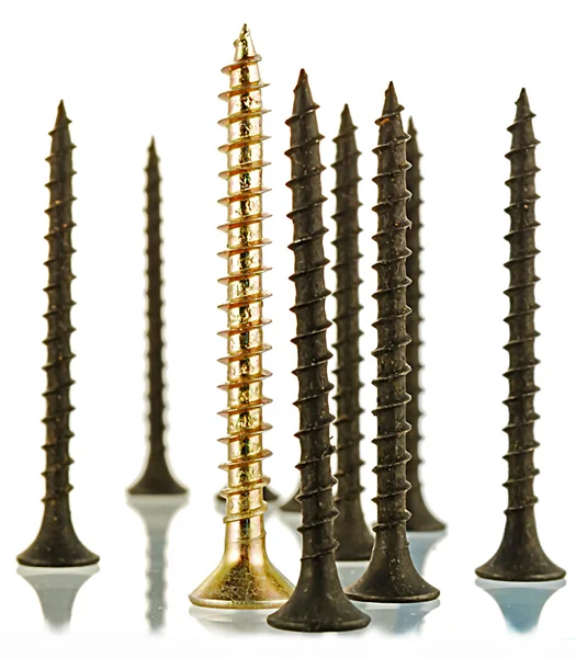 Black and brass angled screws — Stock Photo, Image