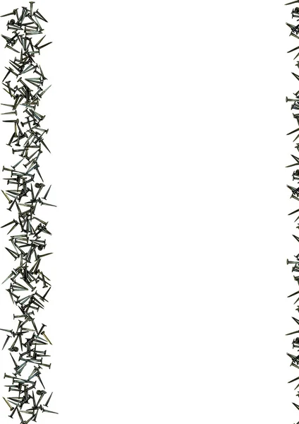 Чорні сталеві цвяхи рамка білого фону — стокове фото